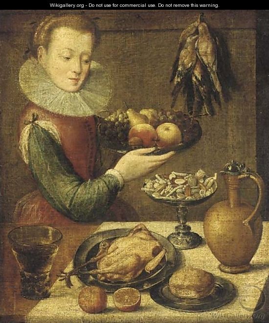 A kitchen maid holding a pewter platter of fruit before a partially draped table with a jug - (after) Lucas Van Valckenborch