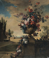 Flowers in a sculpted vase in a landscape - French School