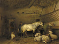 A groom tending a horse in a barn - Frans Lebret