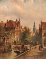 View of a canal in Amsterdam, with figures on a quay - Johannes Franciscus Spohler