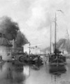 A view of a town with barges on a canal - Johannes Christiaan Karel Klinkenberg
