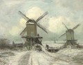 Windmills in a snow covered polder landscape - Louis Apol