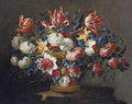 Snowballs, daffodils, tulips, roses and other flowers in a wicker basket on a ledge - Juan De Arellano