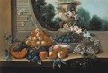 A basket of peaches, with a bowl of plums - Italian School