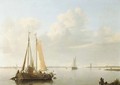 A calm fishing vessels at anchor in a river estuary - Hermanus Koekkoek