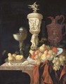 A nautilus cup, a sculpted marble urn, a sculpted porphyry jug and other vessels with oranges, apples, pears and grapes in a blue and white porcelain - Johann Georg (also Hintz, Hainz, Heintz) Hinz
