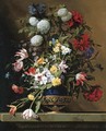 Chrysanthemums, tulips, irises, peonies and other flowers in a lapis vase with gilt ormolu on a sculpted stone ledge - Jean Picart