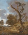 An extensive wooded landscape with a herdsman resting by a tree and hunters on a path in the distance - Jan Wynants