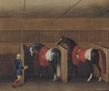 Two racehorses with a groom in a stable - James Seymour