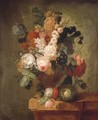Roses, carnations, a tulip and other flowers in a sculpted urn with a bird's nest on a marble ledge with a beetle and a butterfly - Pieter Faes