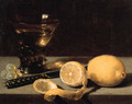 A lemon, a partly peeled lemon, grapes, a roemer and knife on a stone ledge - Pieter Claesz.