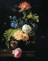 Roses, irises, poppies and other flowers in a glass vase on a ledge - Simon Pietersz. Verelst