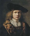 Portrait of a young man, bust-length, in a brocade-lined cloak and a velvet black cap - Samuel Van Hoogstraten