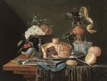 A pie on a pewter plate, grapes and cherries on a pewter tazza, a partly-peeled lemon in a glass roemer and a Dutch delft blue - Christian Luycks