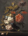 Tulips, roses, peonies, poppies and other flowers in a glass vase on a ledge - Cornelis Kick