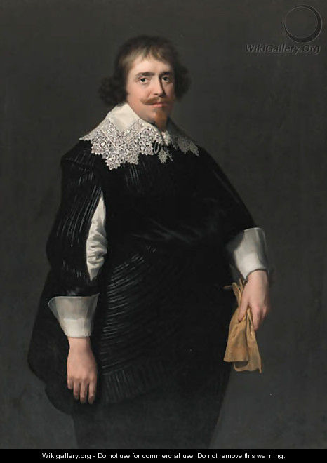 Portrait of a gentleman, three-quarter-length, in a black doublet with slashed sleeves, black hose and sash, his gloves in his left hand - Paulus Moreelse