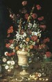 Roses, hollyhocks, lillies, convovulus and other flowers in a classical urn with fruit, a lizard and a snake - Paolo Porpora
