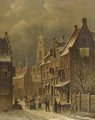 A townview in winter with figures conversing - Oene Romkes De Jongh