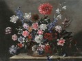 Poppies, tulips, morning glory and other flowers in a basket on a stone ledge - Nicolas Baudesson