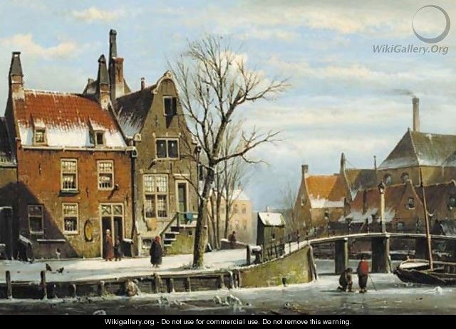 A view in a town with houses along a frozen canal, with townsfolk by a bridge - Willem Koekkoek