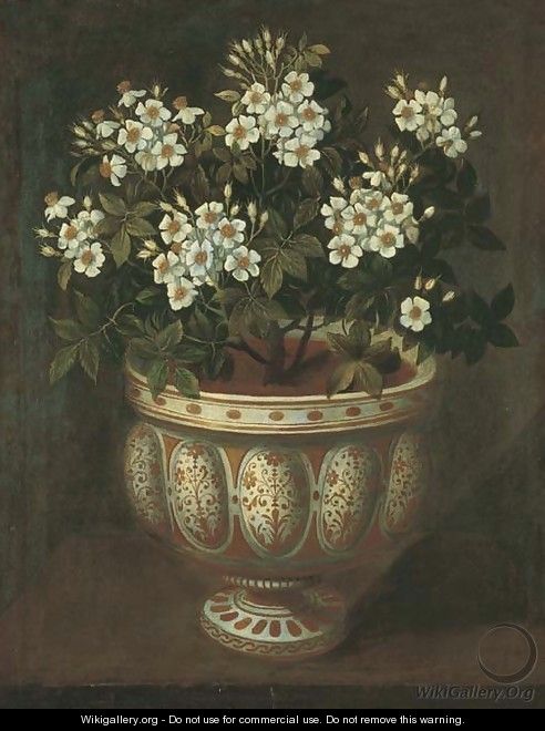 White roses in a lobed-footed copper-lustre maiolica Manises vase on a ledge - Tomas Hiepes