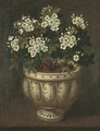 White roses in a lobed-footed copper-lustre maiolica Manises vase on a ledge - Tomas Hiepes