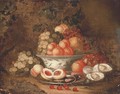 Grapes, peaches and a pomegranate in a blue and white porcelain bowl - Thomas Mertens