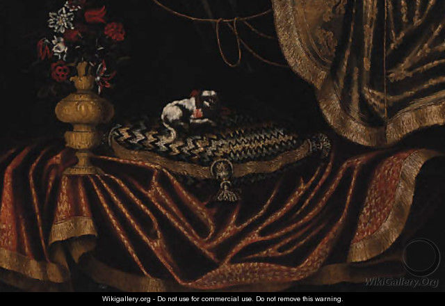 A toy spaniel on an embroidered cushion with a vase of flowers on a draped table - Antonio Gianlisi The Younger