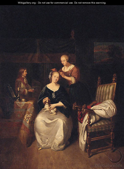 A lady seated in an interior with a spaniel on her lap, a servant tending her hair - (after) Caspar Netscher