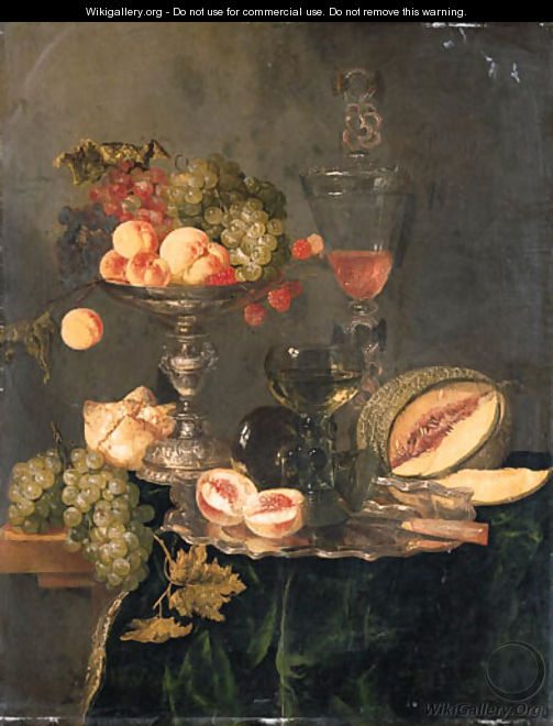 Nectarines, peaches, grapes and raspberries on a silver tazza, two roemers and a sliced peach with a knife on a silver plate, a melon, a bread roll - Abraham Hendrickz Van Beyeren