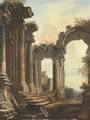 A capriccio of classical ruins with three men conversing at the steps of a temple, a landscape beyond - (after) Hubert Robert