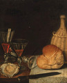 Wine glasses, an oyster, a loaf of bread, a wine bottle and a knife on a partially draped table - (after) Gotthardt Von Wedig