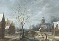 A winter landscape with figures on a frozen waterway in a village - (after) Anthonie Beerstraten