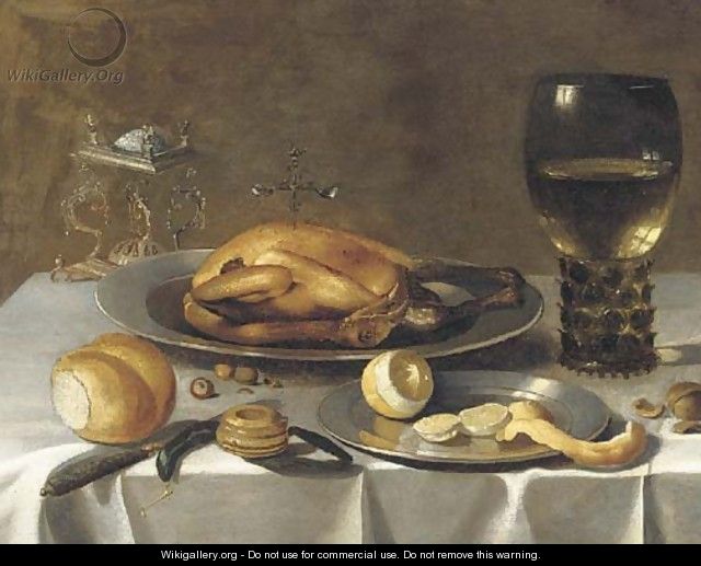 A roemer of wine, a turkey and a partly-peeled lemon on pewter dishes, bread and hazelnuts on a draped table - (after) Pieter Claesz