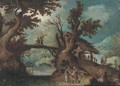 A wooded river landscape with peasants on a path - (after) Pieter Stevens