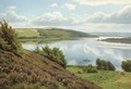 A man rowing in an extensive lake landscape - Axel Birkhammer