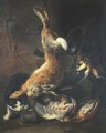 A hunting still life with a hare hanging from a rope by a stone wall - (after) Nicolaas Van Herp