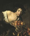 A young boy holding a plate of apples - (after) Niccolo Renieri (see Regnier, Nicolas)