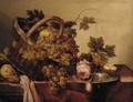A basket of grapes and apples, with roses and a pewter plate on a table - (after) Abraham Hendrickz Van Beyeren