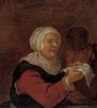 A woman reading a letter to a man in an interior - (after) Adriaen Jansz. Van Ostade