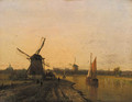 Windmills in a riverlandscape at dusk - Dutch School