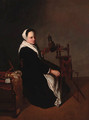 A woman spinning in an interior - Dutch School