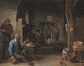 The interior of an inn with peasants smoking by a table and conversing before a fire - David III Teniers