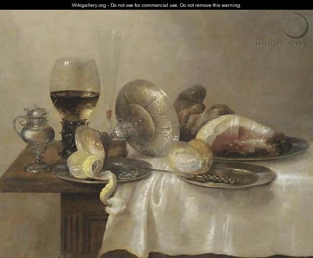 An upturned silver tazza and a partially peeled lemon on a pewter platter - (after) Willem Claesz. Heda