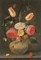 Roses, tulips, carnations and other flowers in a stoneware vase with ornamental relieves on a stone ledge - Clara Peeters