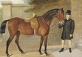 A side saddled hunter held by a groom - English School
