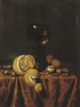 A 'Roemer' of white wine, a partially peeled lemon, walnuts and hazelnuts, all on a draped table - Edwaert Collier