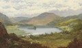Sheep grazing in a mountainous lake landscape - Edmund Hughes