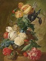 A Still Life Of Flowers, Including Tulips, A Delphinium And An Iris In A Stone Vase, A Bird