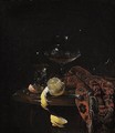 Still Life Of A Peeled Lemon, A Roemer, A Wine-glass, A Knife And A Rug, All Upon A Marble Top Draped With A Carpet - Willem Kalf